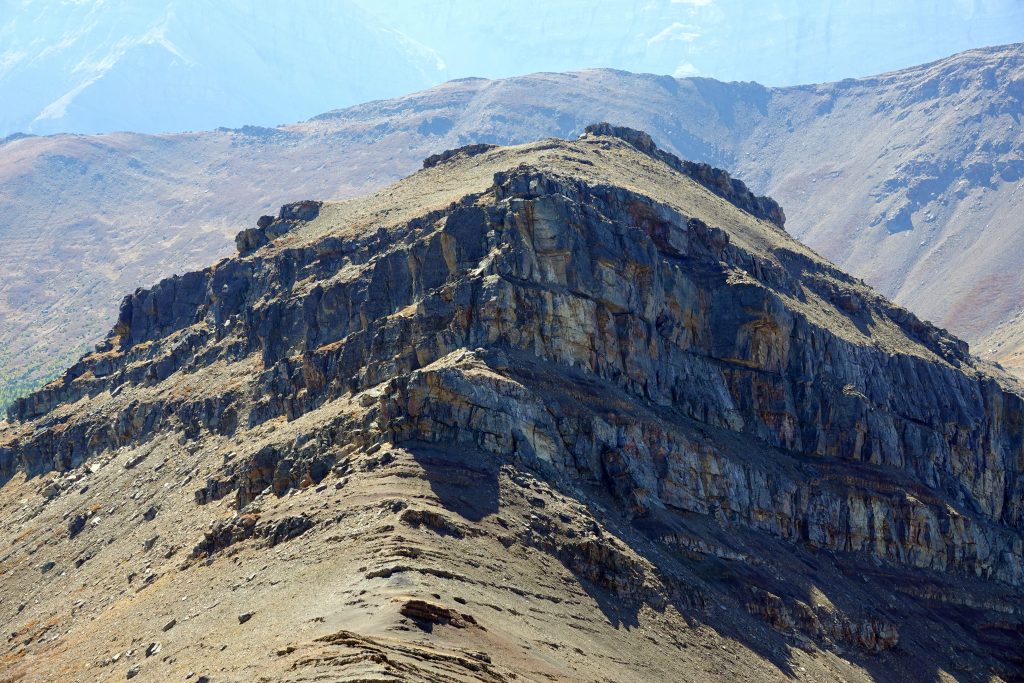 False summit of Mt Collembola and descent to the col between Collembola summits, as seen from the true summit